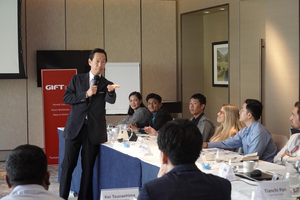 A speaker addresses GIFT participants during a classroom discussion