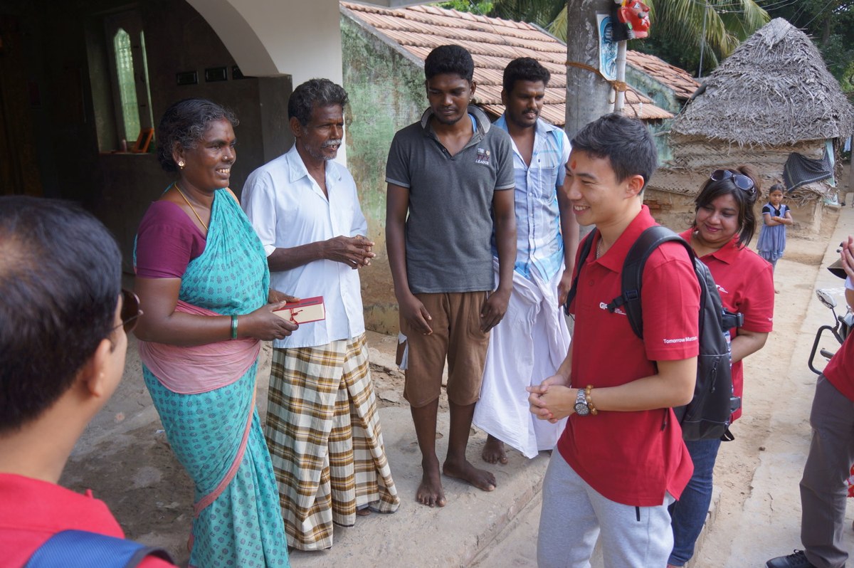 GIFT participants speak with community members during a field visit