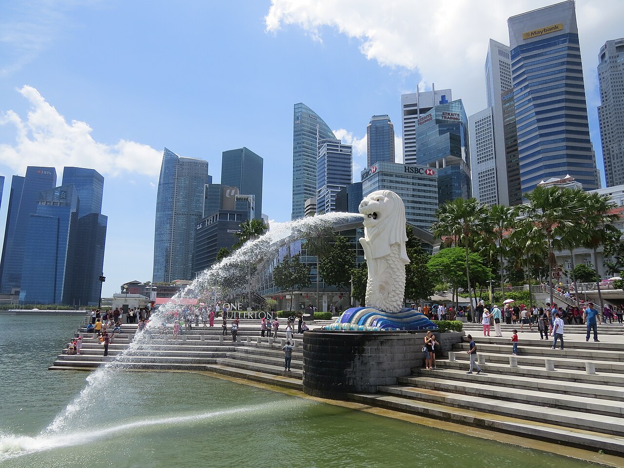 The Merlion fountain and Singapore skyline beside Marina Bay in bright daylight