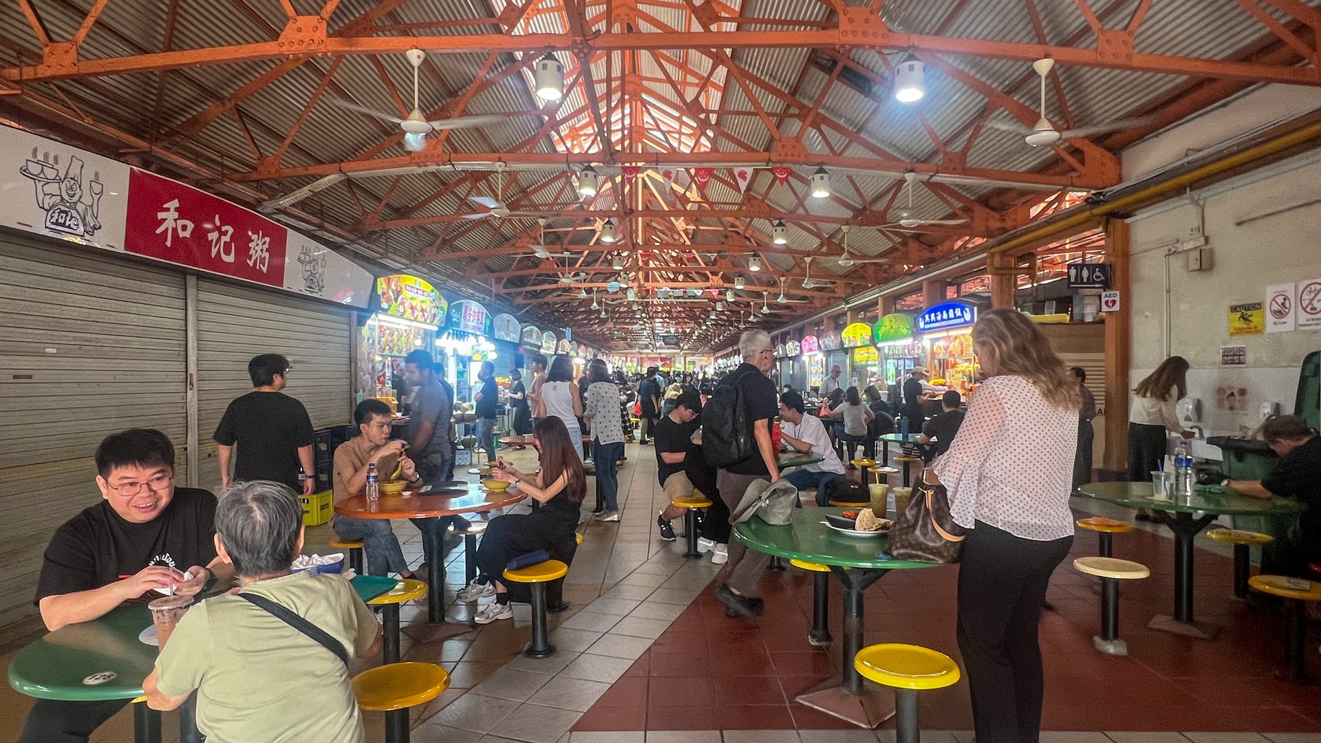Diners and stalls inside Singapore’s Maxwell Food Centre